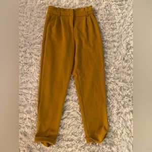 Mustard Yellow Paper Bag Pant, stretchy material, cuffed bottom.